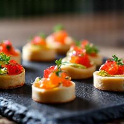 High-end artisan wedding canapes on a slate platter